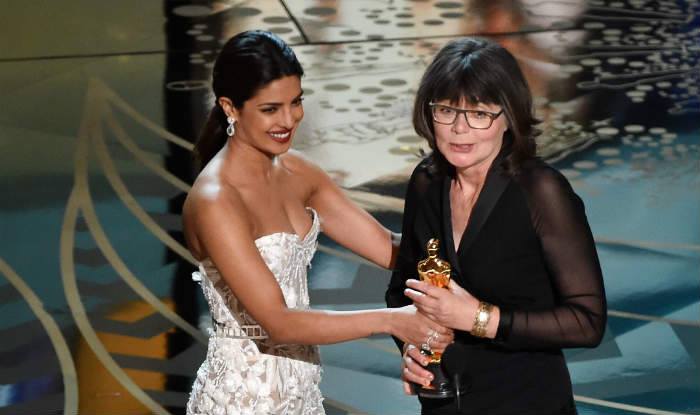 Priyanka as she presents the Best Editing award to Margaret Sixel who won Best Film Editing for 'Mad Max Fury Road